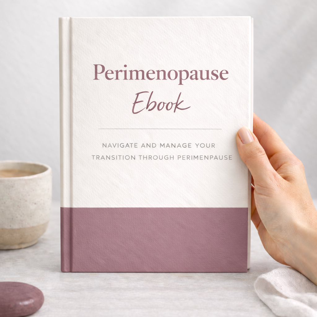 Perimenopause ebook held by a hand on a light surface with a neutral background